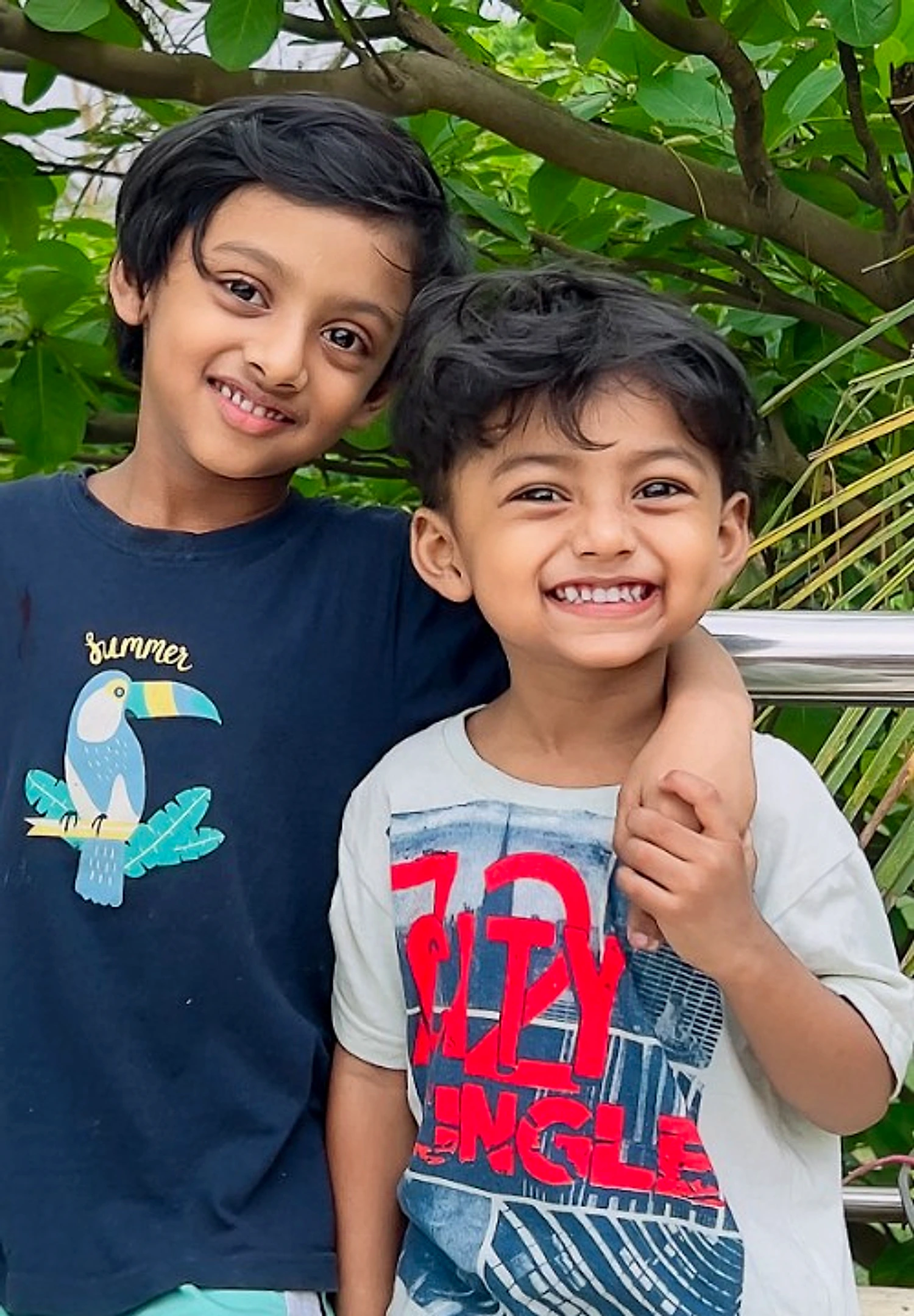Two brothers smiling together outdoors